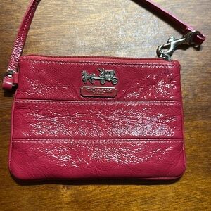 glossy pink coach wristlet used